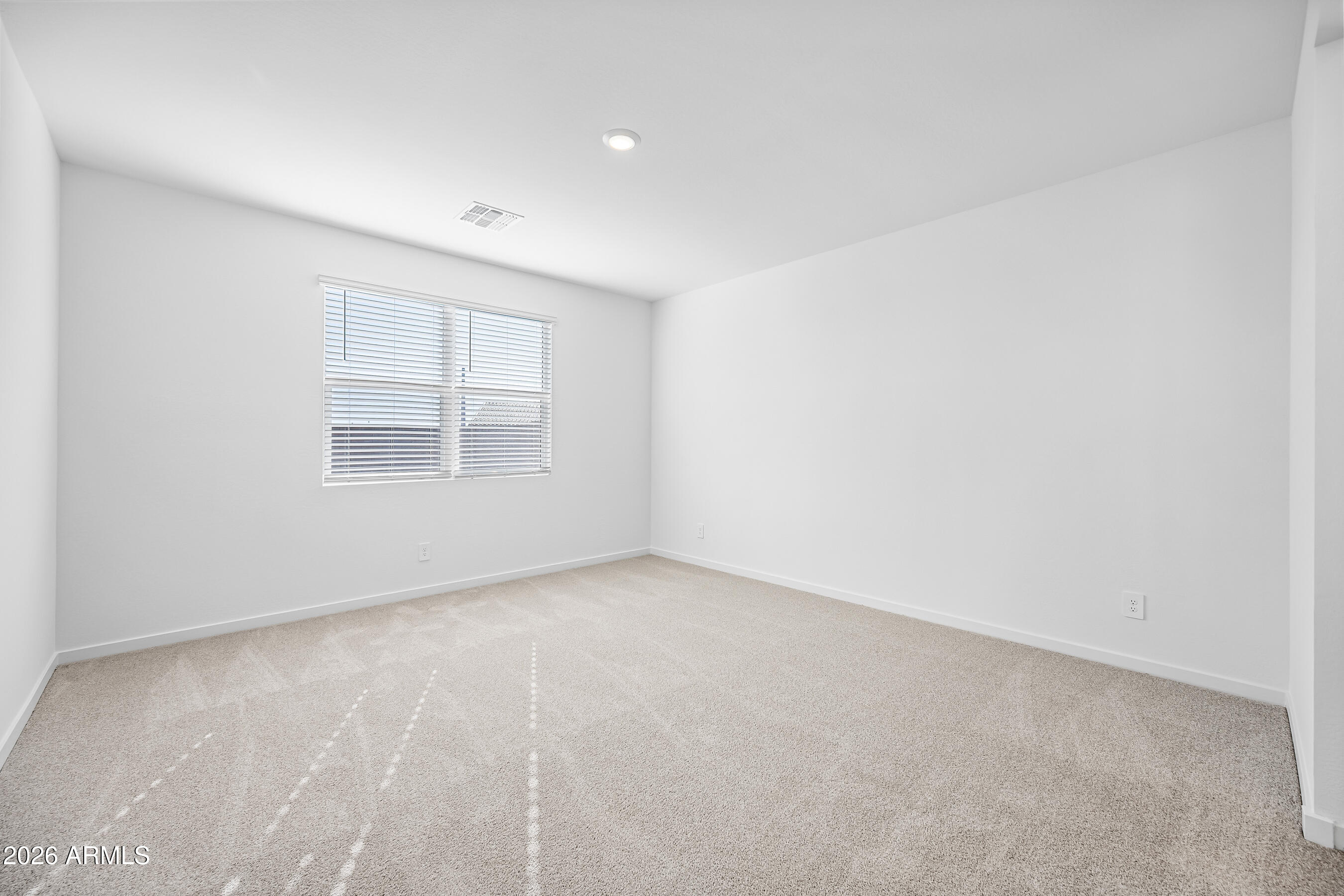 2563 Grenache Road San Tan Valley, AZ 85143 - Photo 12 of 25 an empty room with windows