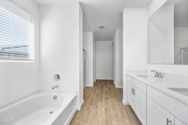 a view of bathroom with a bathtub and shower