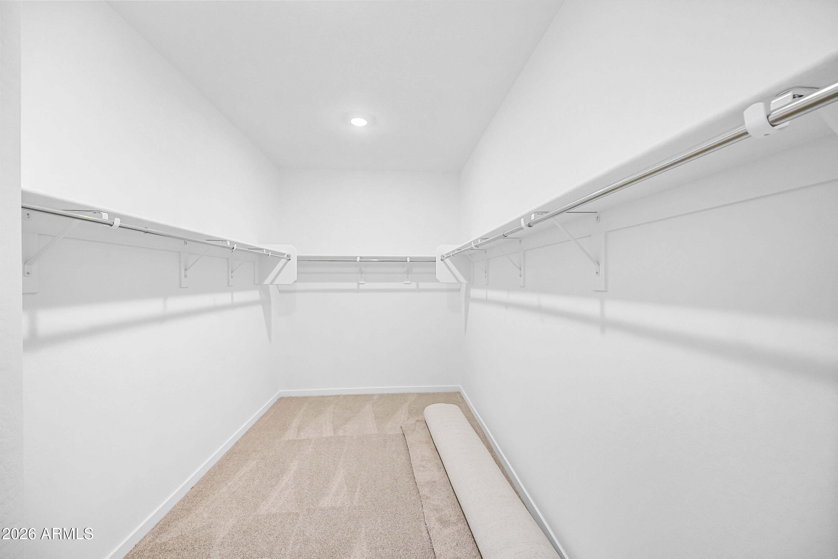 2563 Grenache Road San Tan Valley, AZ 85143 - Photo 16 of 25 a view of a room with racks on the wall