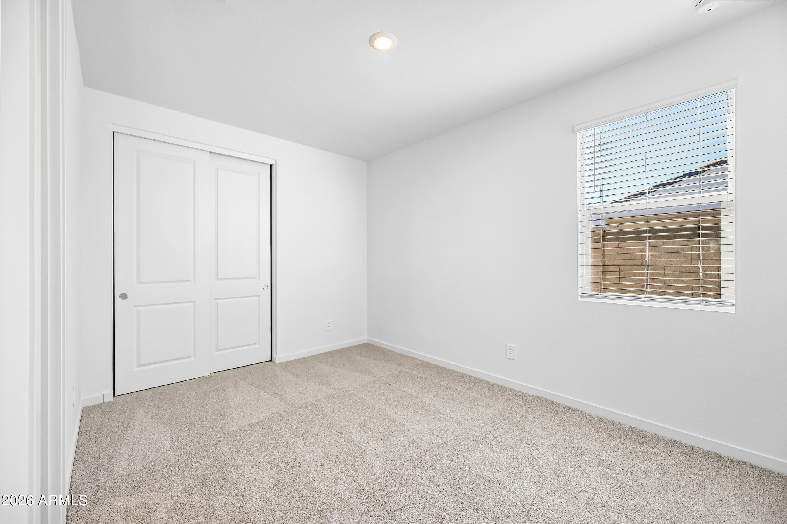 2563 Grenache Road San Tan Valley, AZ 85143 - Photo 18 of 25 an empty room with windows