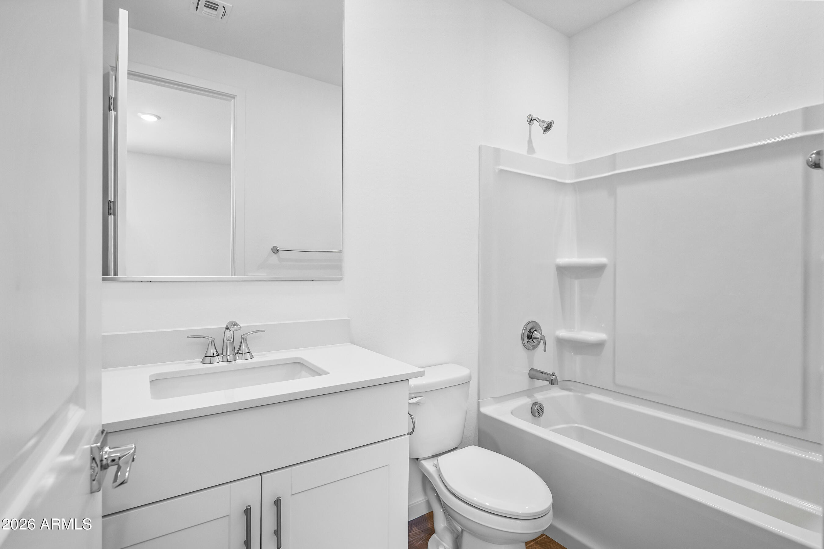 2563 Grenache Road San Tan Valley, AZ 85143 - Photo 19 of 25 a bathroom with a sink toilet a vanity and shower