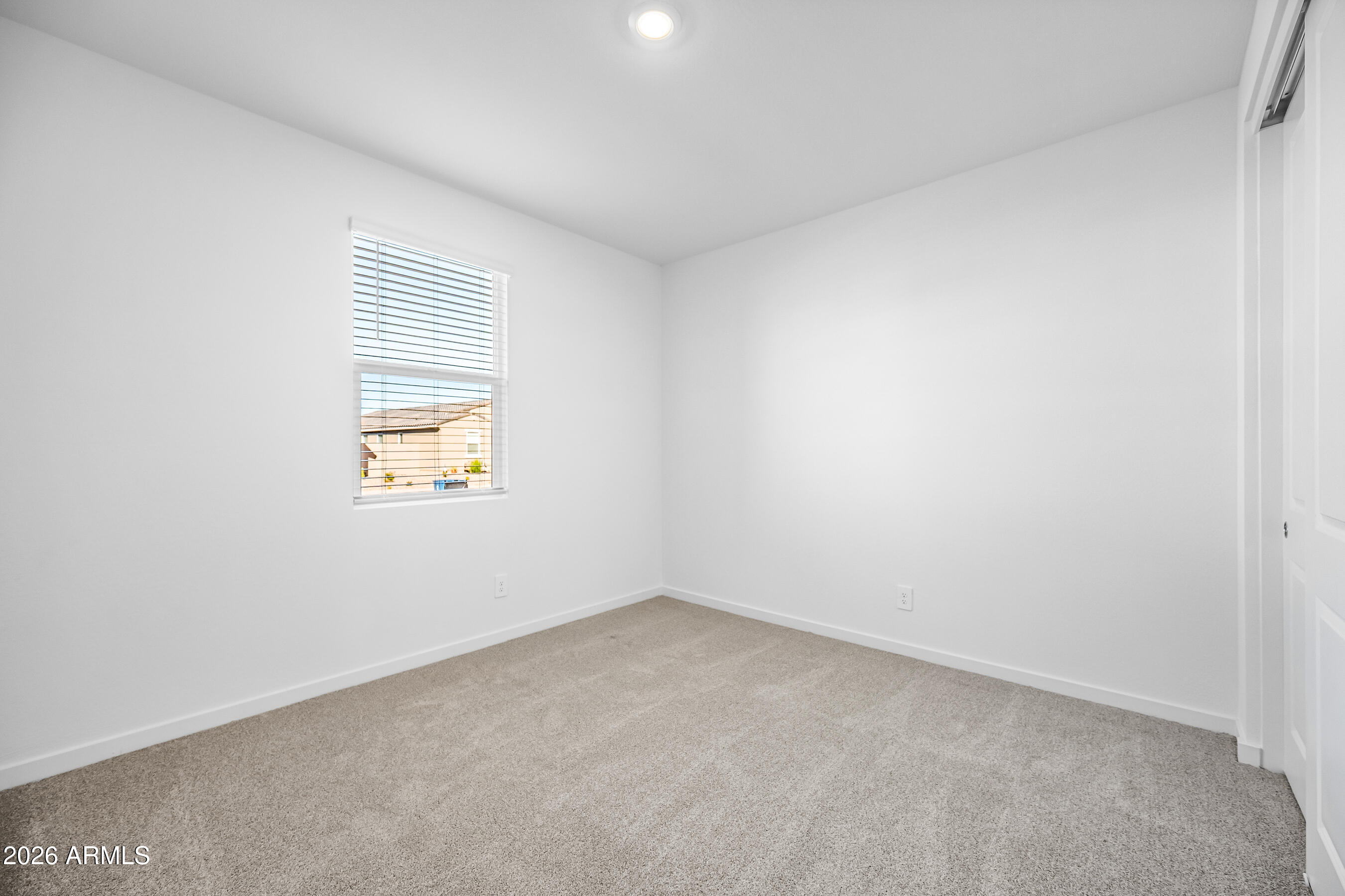 2563 Grenache Road San Tan Valley, AZ 85143 - Photo 20 of 25 an empty room with a window
