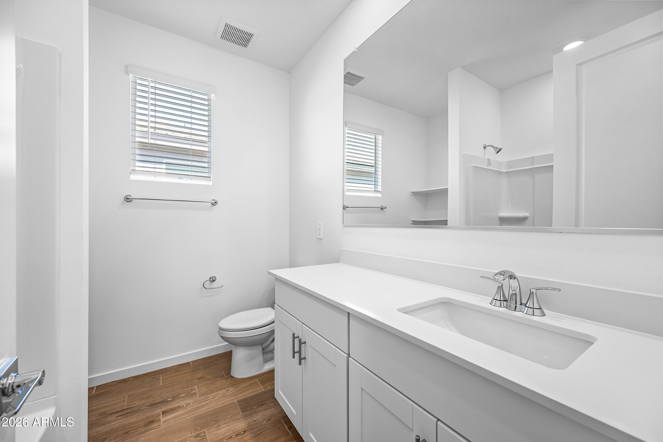 2563 Grenache Road San Tan Valley, AZ 85143 - Photo 22 of 25 a bathroom with a granite countertop sink toilet and a mirror