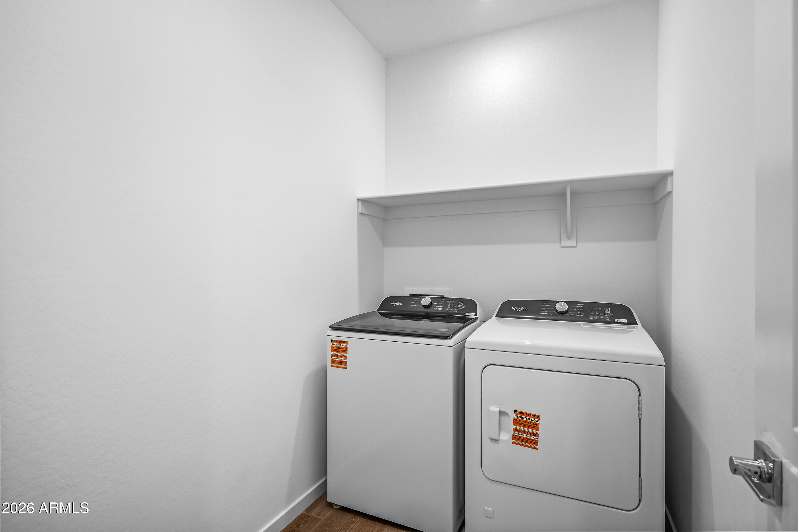 2563 Grenache Road San Tan Valley, AZ 85143 - Photo 23 of 25 a utility room with dryer and washer