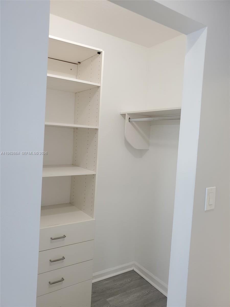 14765 Southwest 132nd Place Miami, FL 33186 - Photo 26 of 52 a view of an empty walk in closet