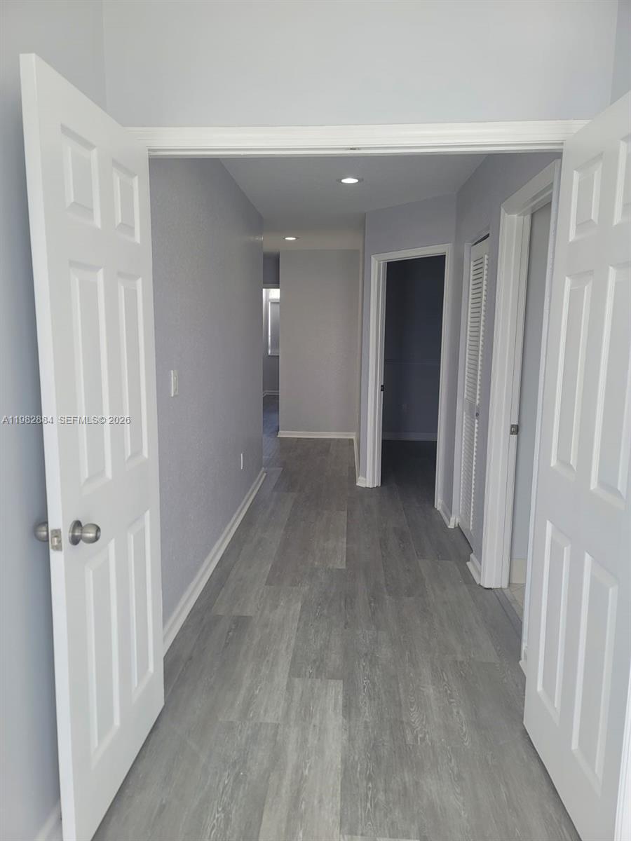 14765 Southwest 132nd Place Miami, FL 33186 - Photo 42 of 52 wooden floor and a staircase in a room