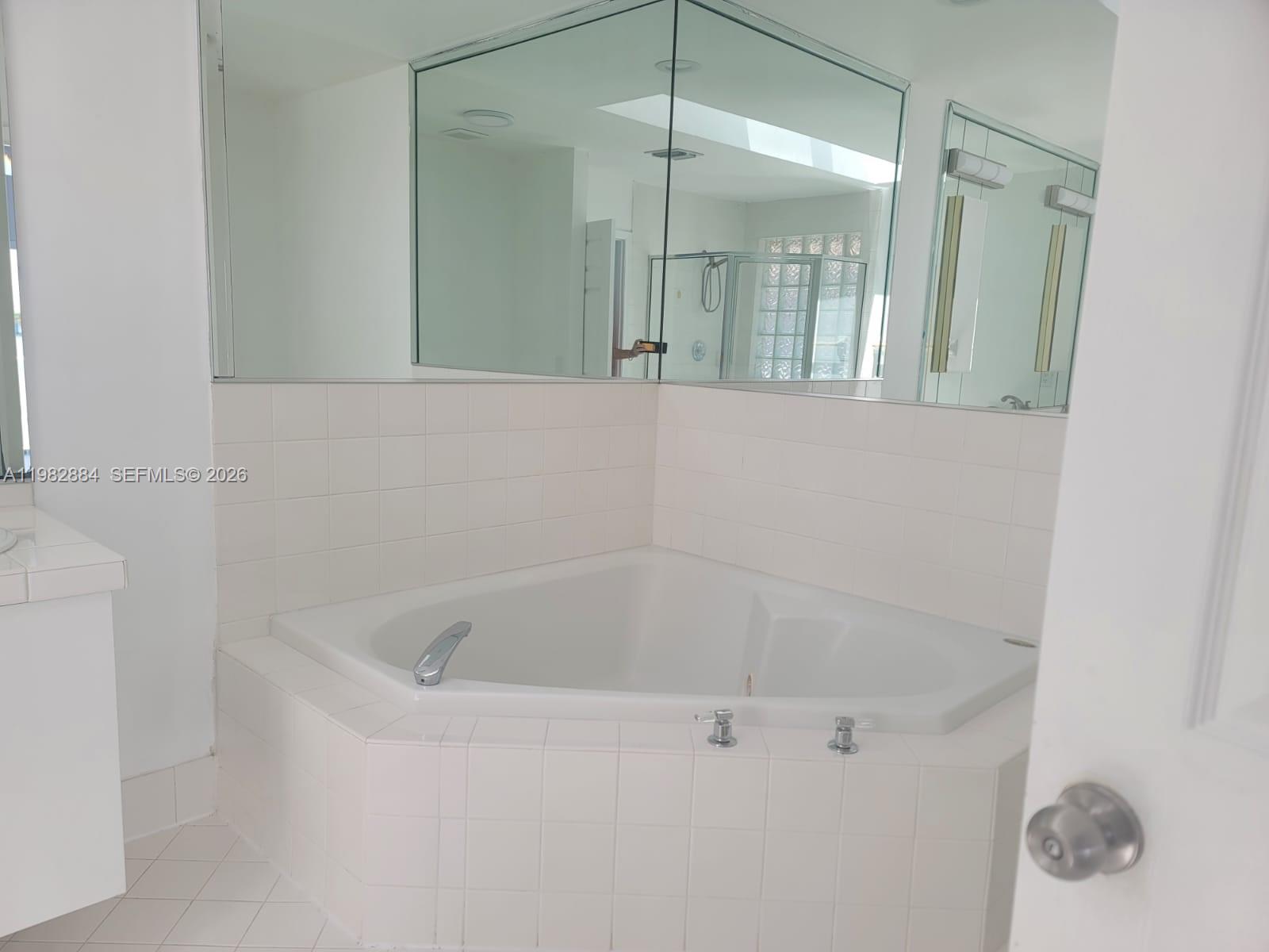 14765 Southwest 132nd Place Miami, FL 33186 - Photo 43 of 52 a bathroom with a tub