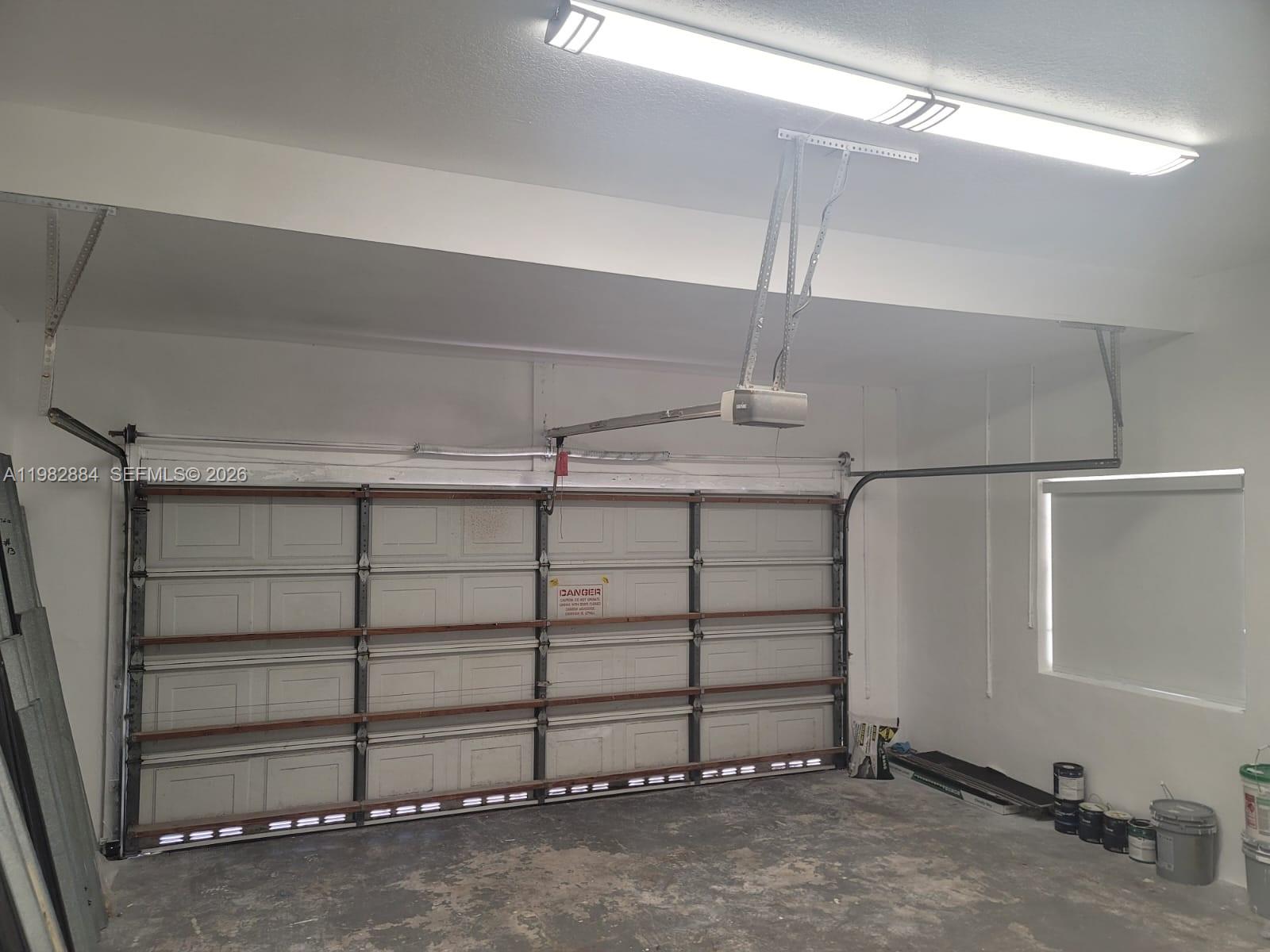 14765 Southwest 132nd Place Miami, FL 33186 - Photo 44 of 52 a view of a room with rack on the wall