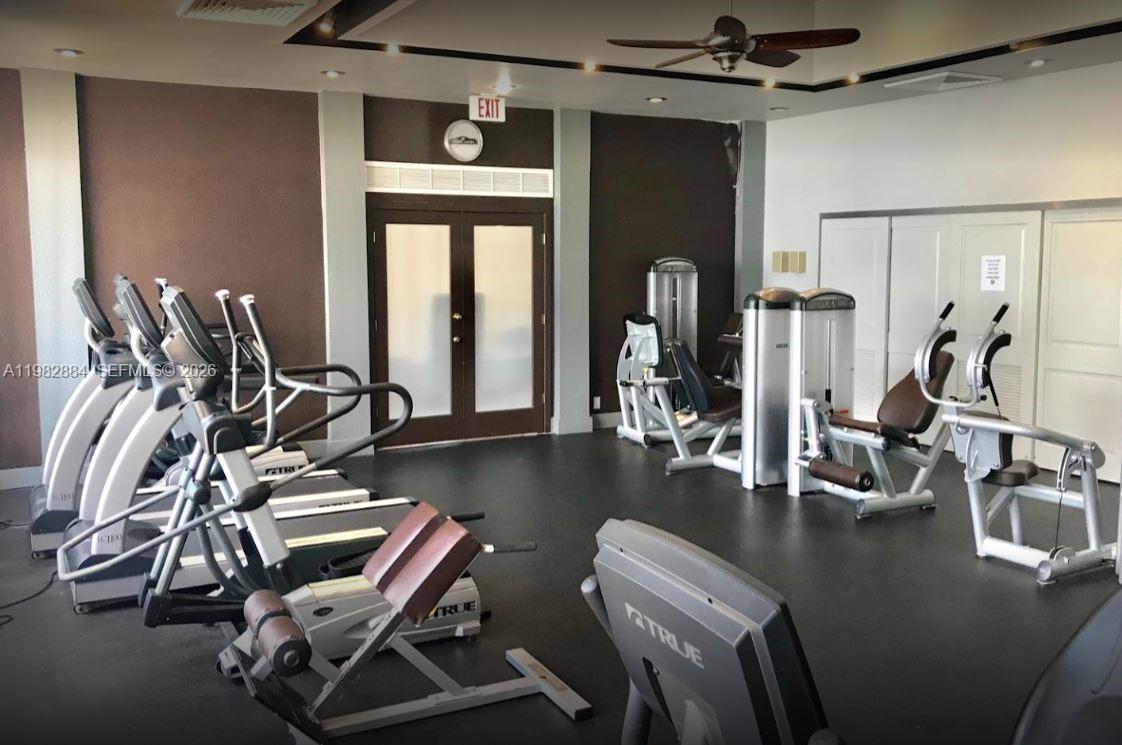 14765 Southwest 132nd Place Miami, FL 33186 - Photo 50 of 52 a view of a room with gym equipment