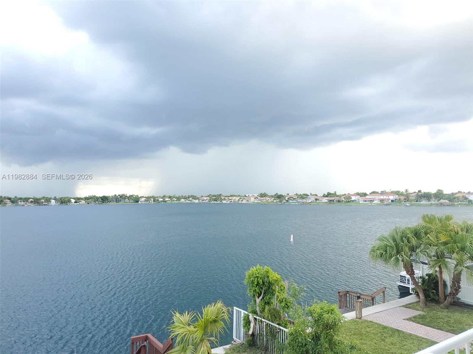 14765 Southwest 132nd Place Miami, FL 33186 - Photo 5 of 52 a view of a lake with a big yard