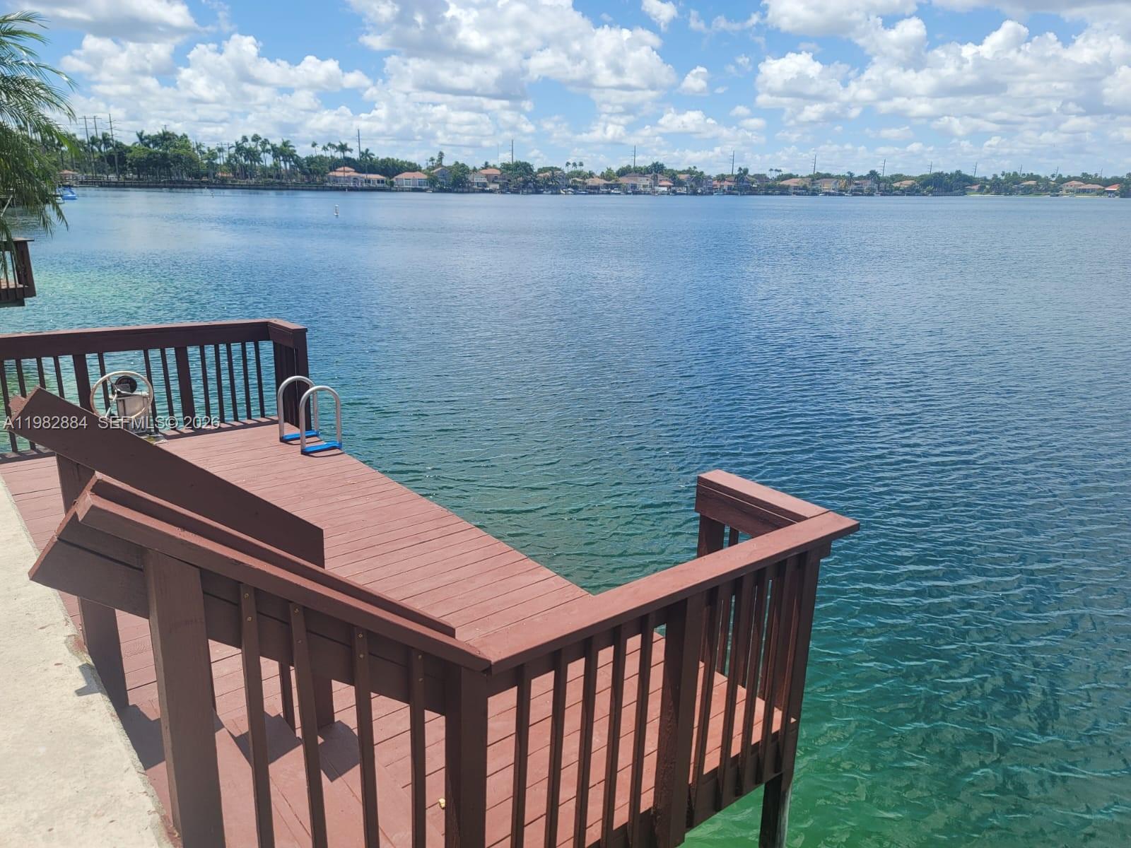 14765 Southwest 132nd Place Miami, FL 33186 - Photo 8 of 52 a view of a roof deck with lake and city view