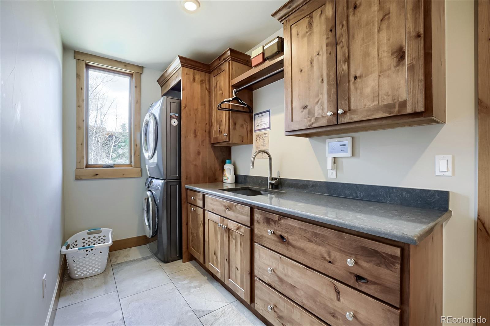 836 Maryland Creek Road Silverthorne, CO 80498 - Photo 27 of 49 a kitchen with stainless steel appliances granite countertop a sink and cabinets