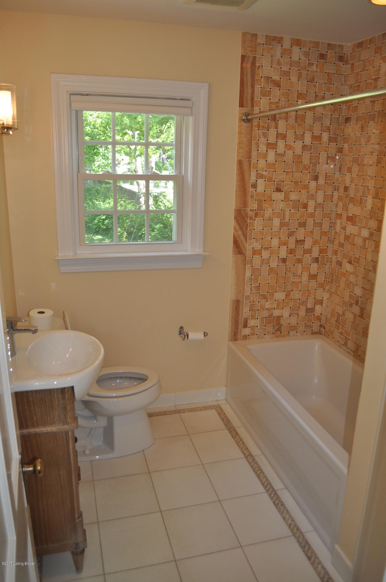 2387 Valley Vista Road Louisville, KY 40205 - Photo 12 of 14 Upstairs bathroom has been remodeled and features a very pretty basket weave tile surround in the shower
