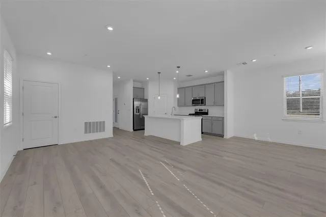 a view of kitchen with wooden floor
