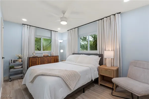 a bedroom with a large bed and a window