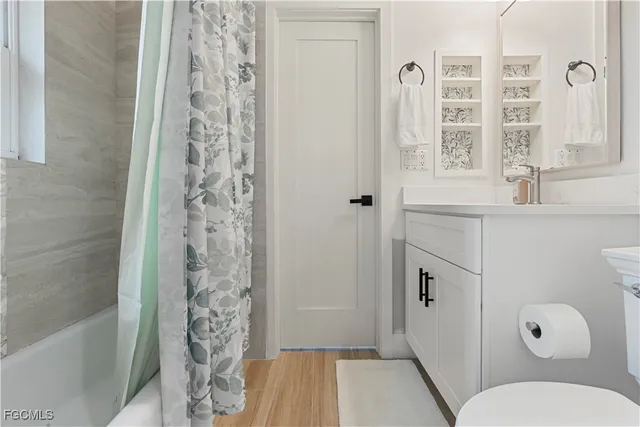 a bathroom with a toilet and shower