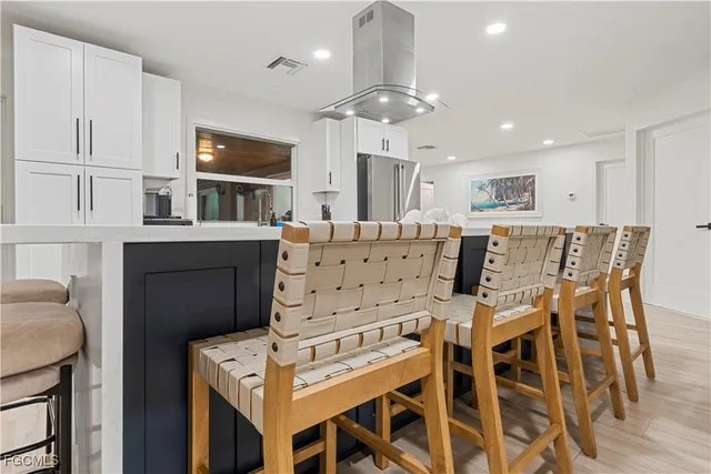 a view of kitchen with cabinets and wooden floor