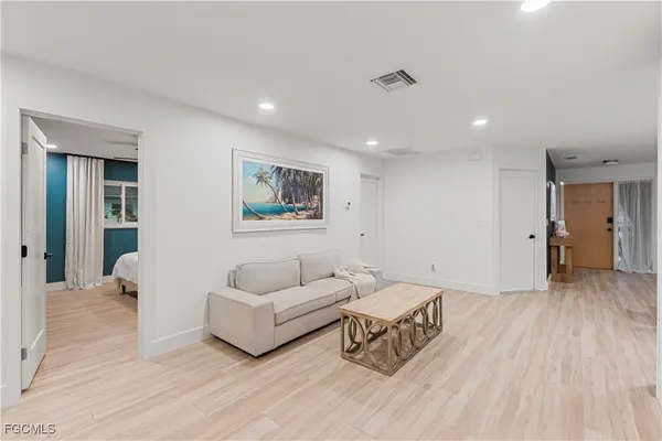 a bedroom with two beds and a dresser