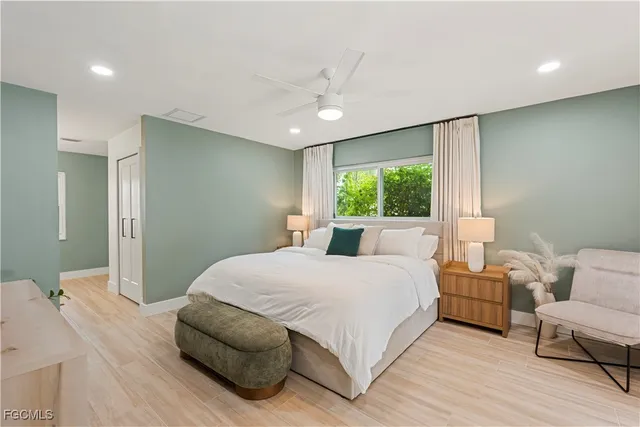 a bedroom with bed and window