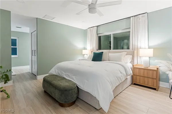 a bedroom with a bed and a couch