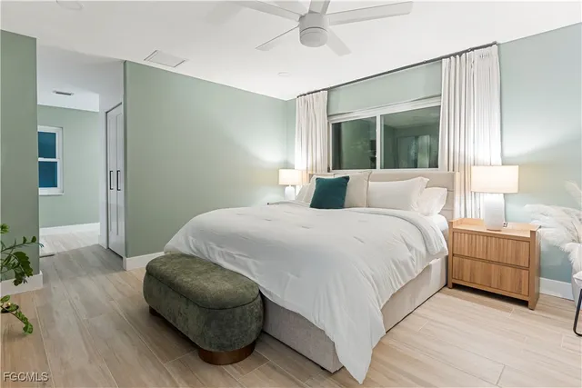 a bedroom with a bed and a couch