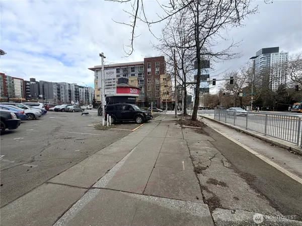 a view of street with parked cars