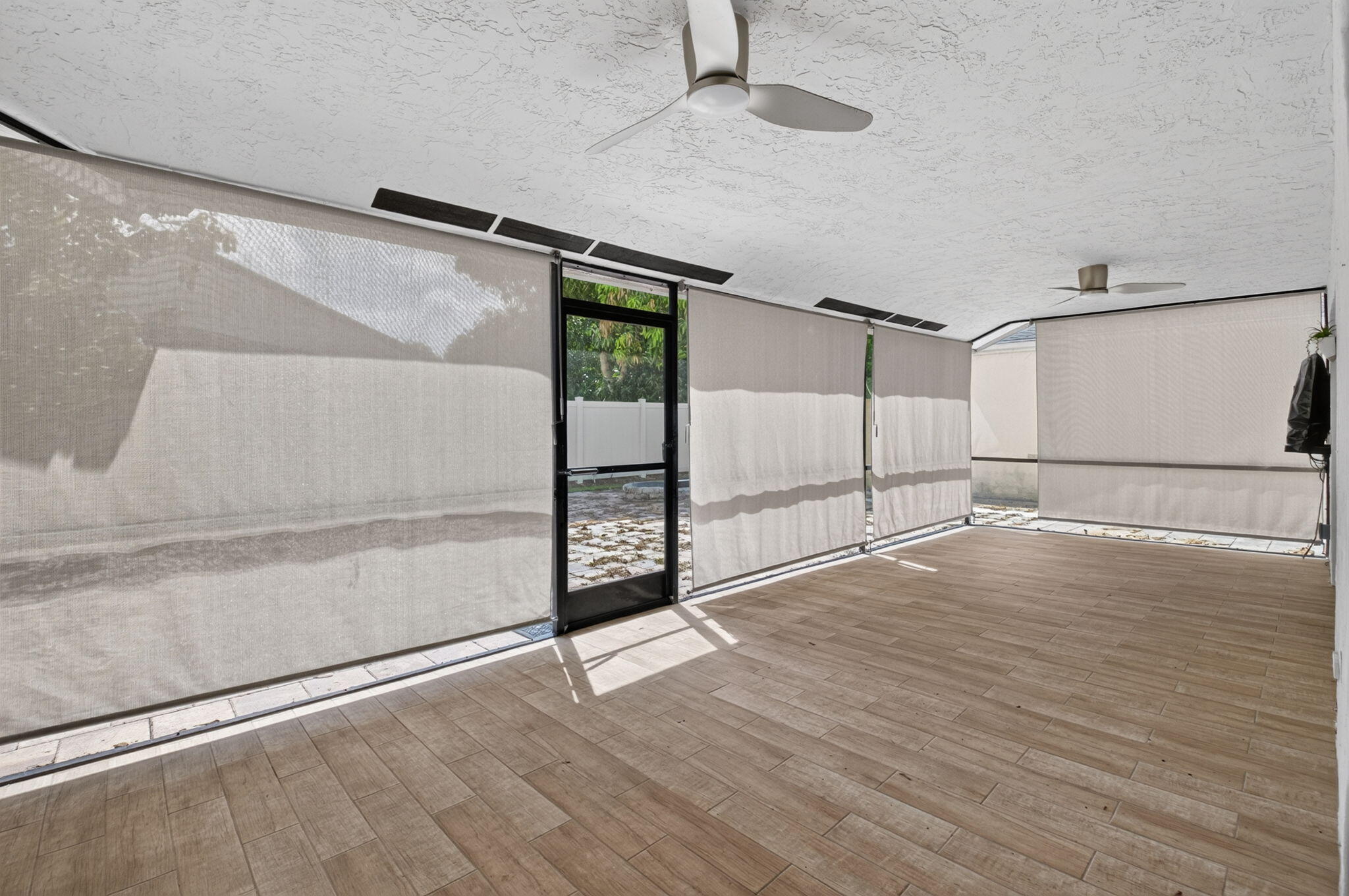 21070 Woodspring Avenue Boca Raton, FL 33428 - Photo 19 of 30 a view of an empty room with wooden floor