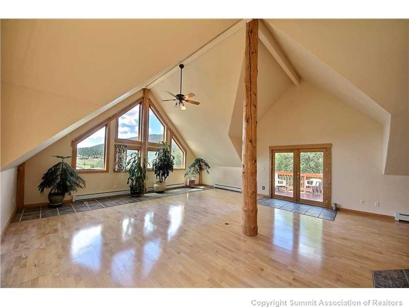 63 Idlewild Drive Summit Cove, CO 80435 - Photo 2 of 25 a view of a livingroom with wooden floor and stairs
