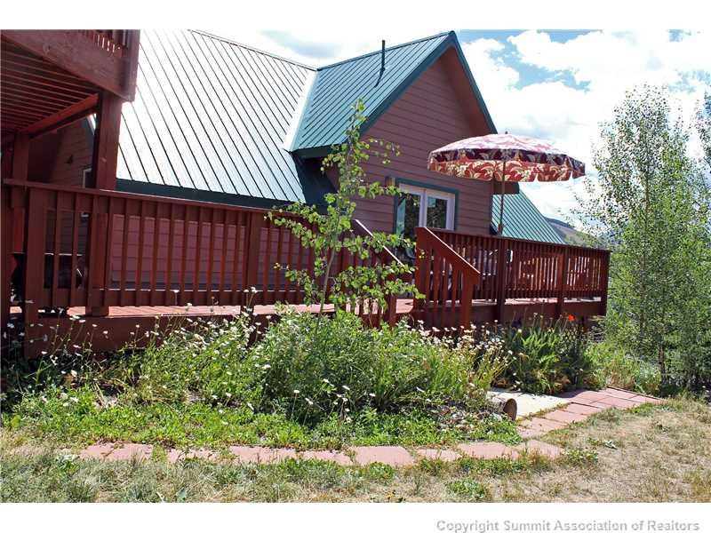 63 Idlewild Drive Summit Cove, CO 80435 - Photo 19 of 25 a view of a house with a yard