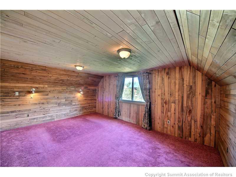 63 Idlewild Drive Summit Cove, CO 80435 - Photo 22 of 25 a view of empty room with floor to ceiling window