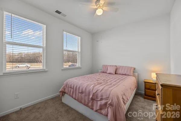 a bedroom with a bed and a closet
