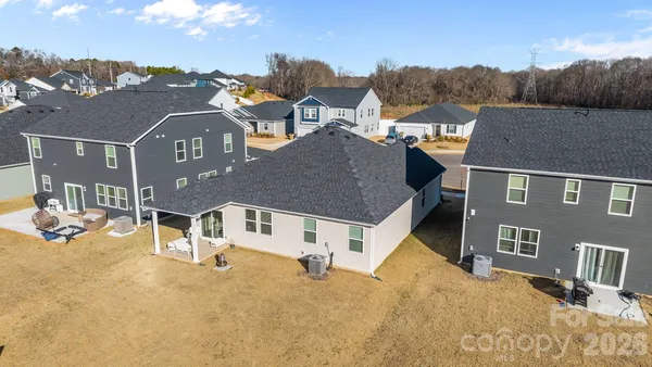 an aerial view of a house with lake view