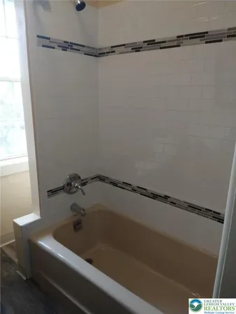 a bathroom with a bathtub