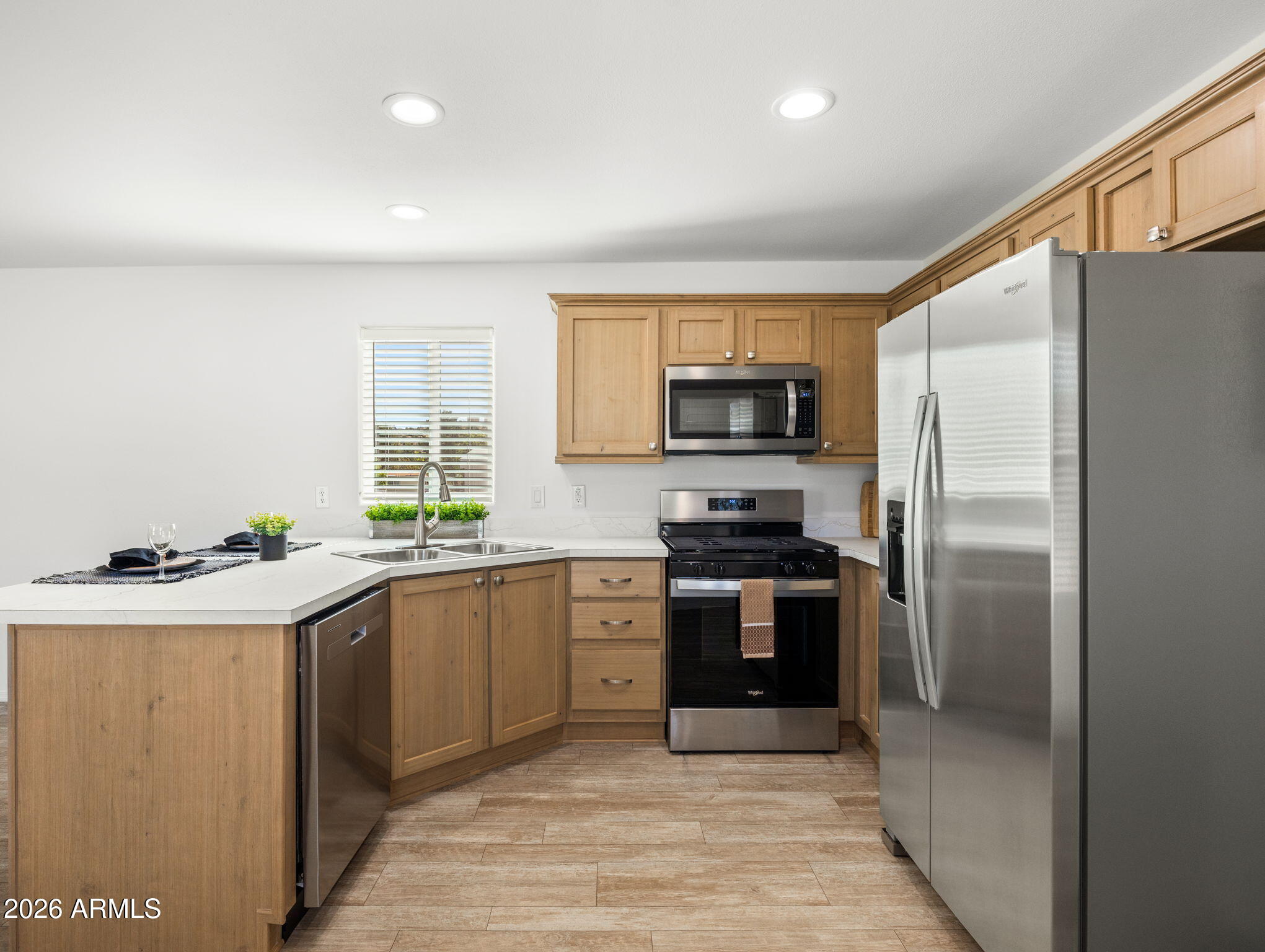 18296 Frontier Road Peeples Valley, AZ 86332 - Photo 13 of 44 a kitchen with stainless steel appliances granite countertop a refrigerator and a stove top oven