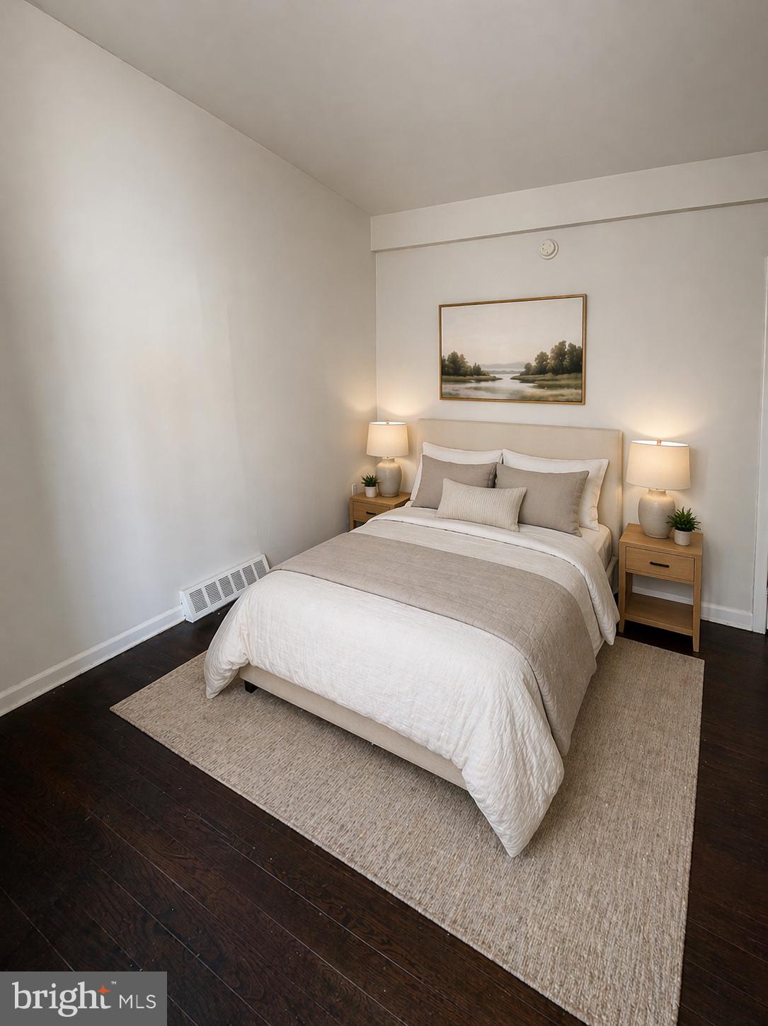 5608-00 Ridge Avenue, Unit R2 Philadelphia, PA 19128 - Photo 5 of 6 a bedroom with a bed and night stand