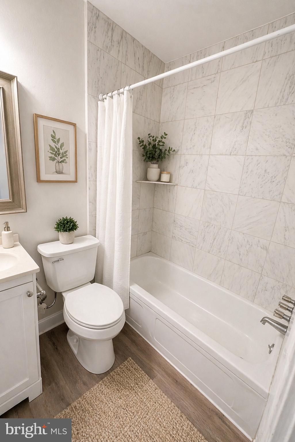 5608-00 Ridge Avenue, Unit R2 Philadelphia, PA 19128 - Photo 6 of 6 a bathroom with a sink toilet and a bathtub