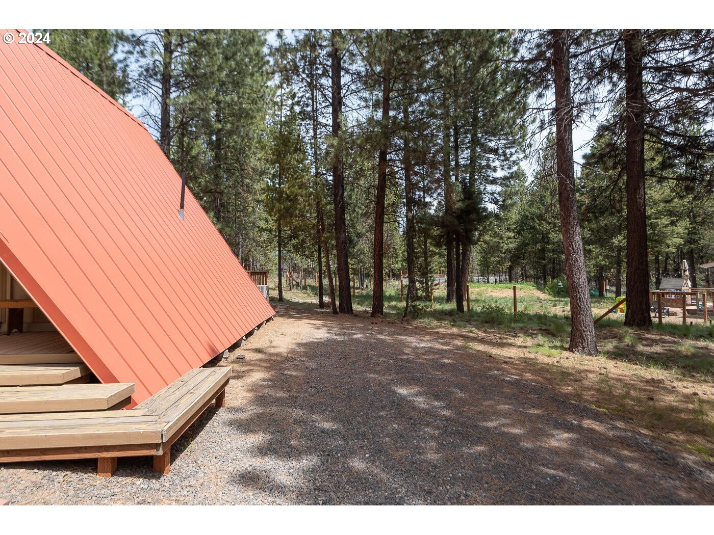 16942 Downey Road Bend, OR 97707 - Photo 16 of 22 a view of a backyard with trees