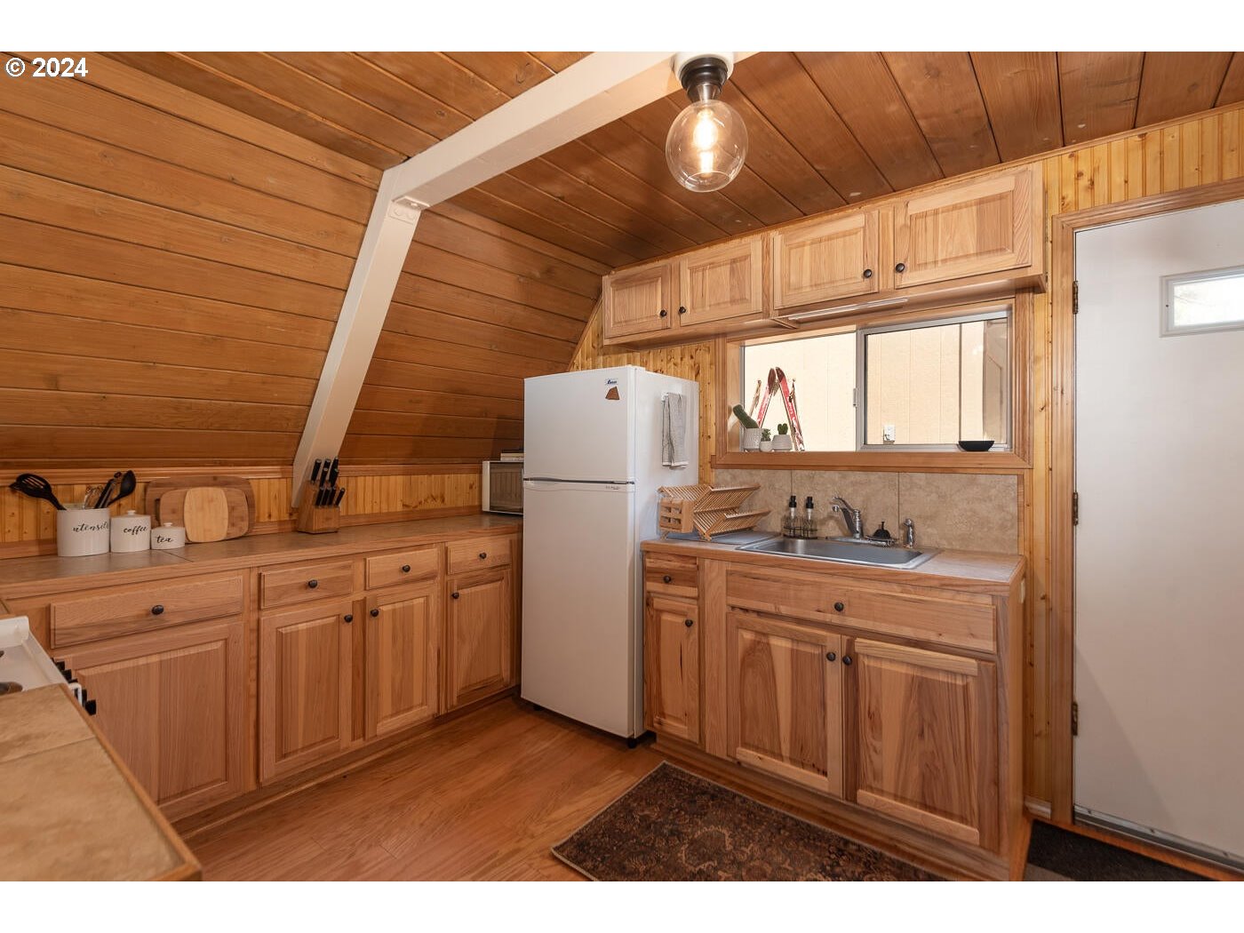 16942 Downey Road Bend, OR 97707 - Photo 6 of 22 a kitchen with appliances cabinets and a sink