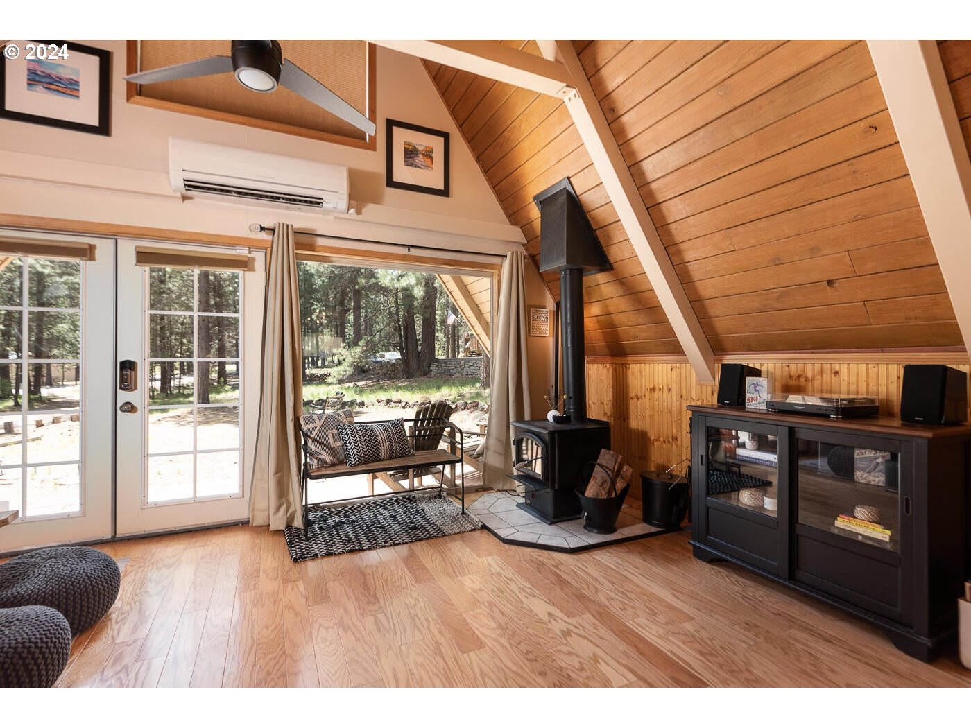 16942 Downey Road Bend, OR 97707 - Photo 9 of 22 a living room with furniture and a floor to ceiling window