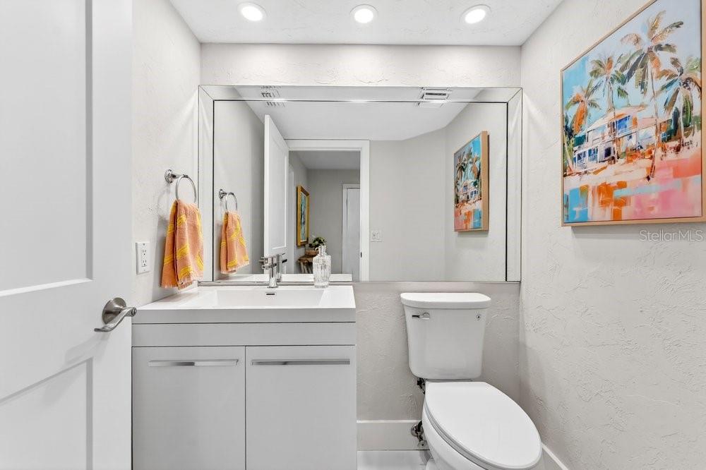7838 La Mirada Drive Boca Raton, FL 33433 - Photo 13 of 43 a bathroom with a toilet sink and mirror