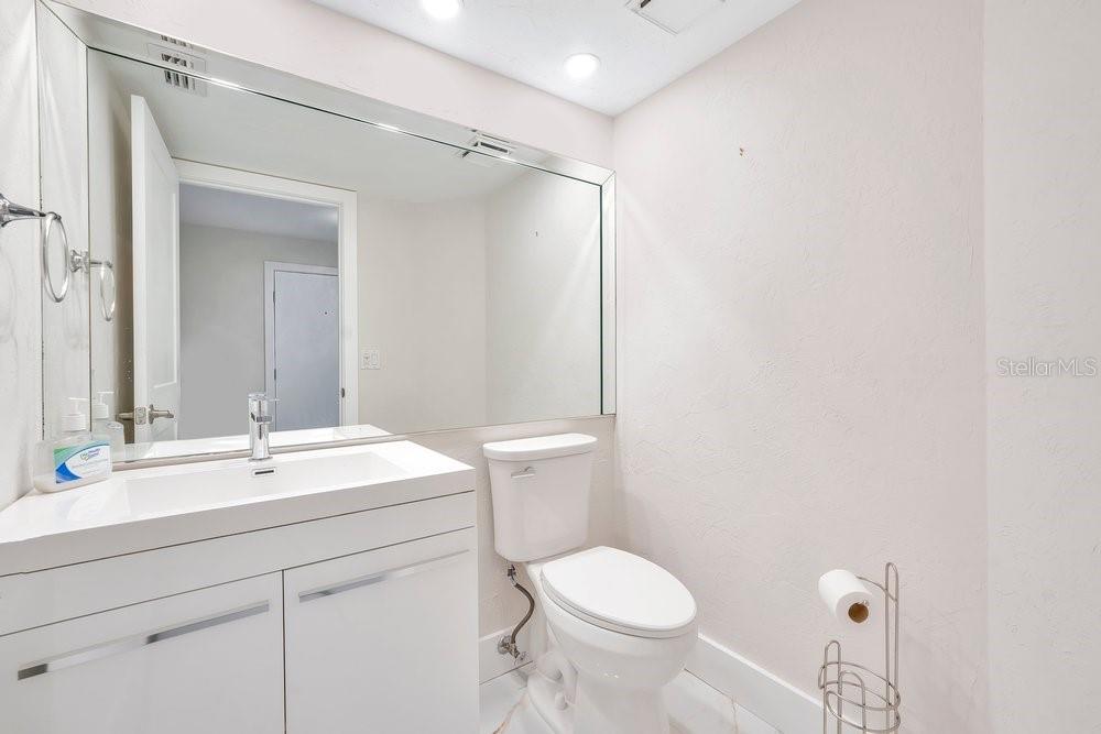 7838 La Mirada Drive Boca Raton, FL 33433 - Photo 14 of 43 a bathroom with a sink mirror vanity and toilet