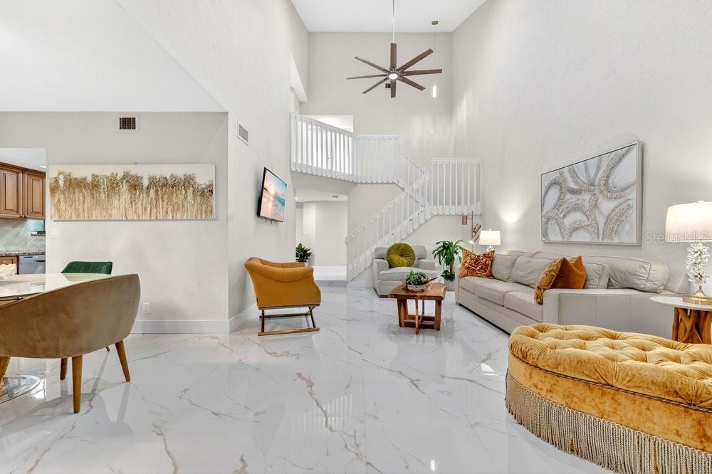 7838 La Mirada Drive Boca Raton, FL 33433 - Photo 18 of 43 a living room with furniture and a painting on the wall