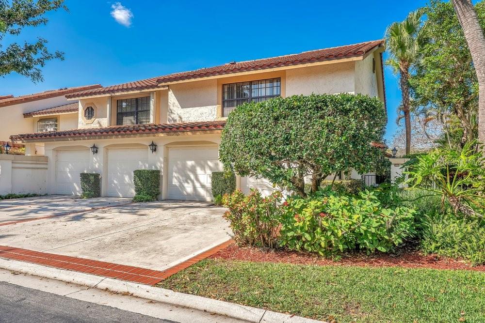 7838 La Mirada Drive Boca Raton, FL 33433 - Photo 2 of 43 a front view of a house with garden