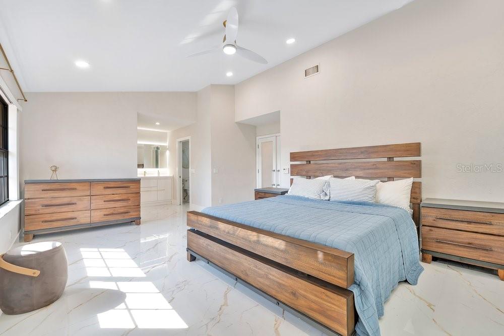 7838 La Mirada Drive Boca Raton, FL 33433 - Photo 26 of 43 a bedroom with a bed and a dresser