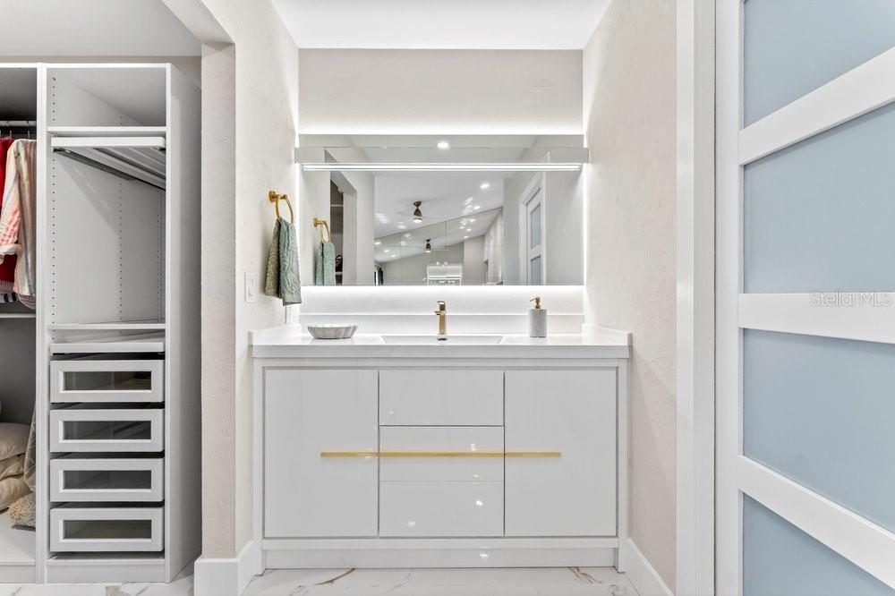 7838 La Mirada Drive Boca Raton, FL 33433 - Photo 27 of 43 a bathroom with a sink and a mirror