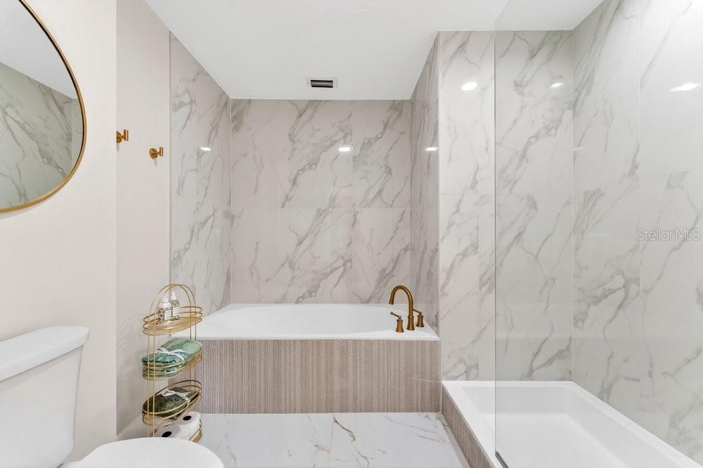 7838 La Mirada Drive Boca Raton, FL 33433 - Photo 28 of 43 a bathroom with a sink a toilet and a bathtub