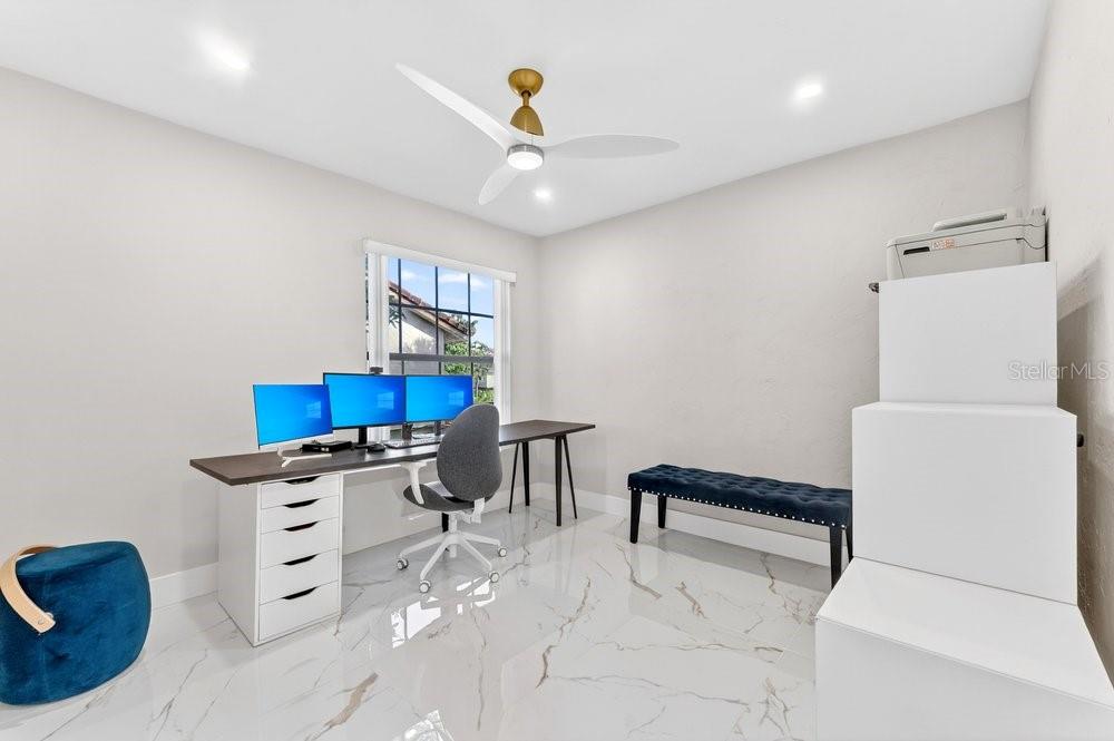 7838 La Mirada Drive Boca Raton, FL 33433 - Photo 29 of 43 a living room with furniture and a chandelier