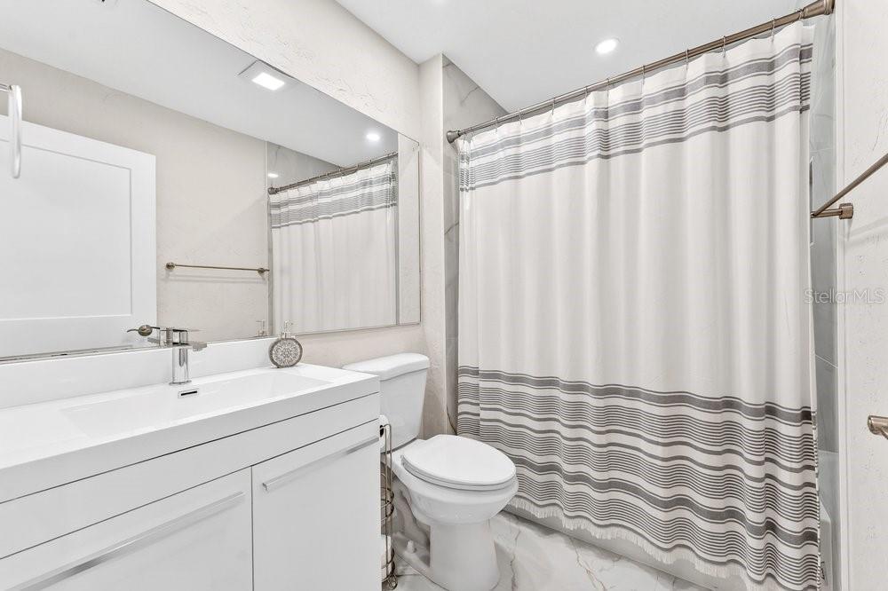 7838 La Mirada Drive Boca Raton, FL 33433 - Photo 31 of 43 a bathroom with a sink a toilet and shower