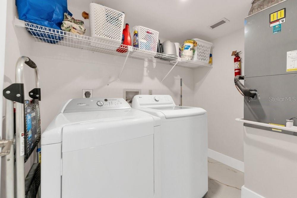 7838 La Mirada Drive Boca Raton, FL 33433 - Photo 33 of 43 a utility room with dryer and washer