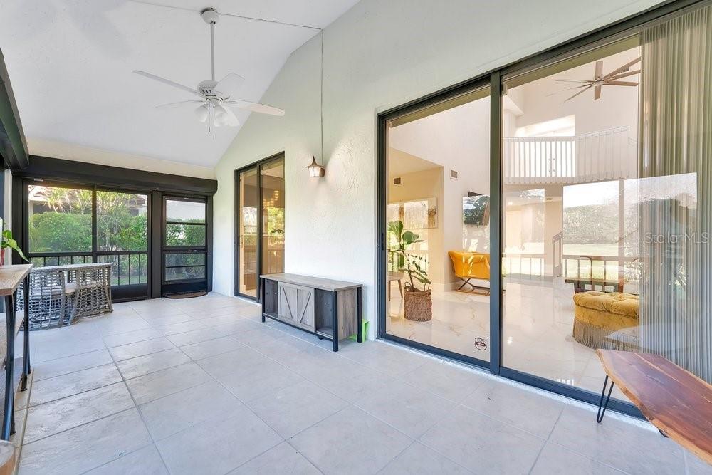 7838 La Mirada Drive Boca Raton, FL 33433 - Photo 34 of 43 a spacious bedroom with a large window and a balcony